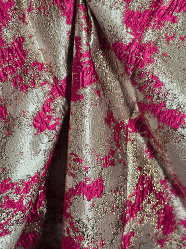 Close-up of pink and gold textured fabric