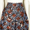 Front view of handmade Adire shorts in size 10/12 on mannequin