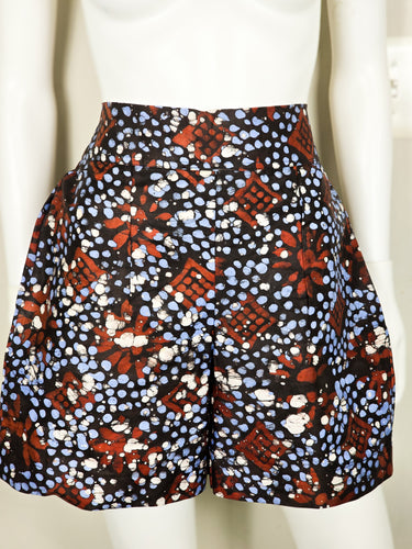 Front view of handmade Adire shorts in size 10/12 on mannequin