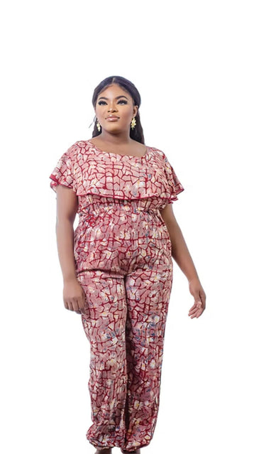 Close-up of handcrafted Adire fabric pattern with floral accents