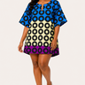 Woman wearing a colorful patterned dress on a white background
