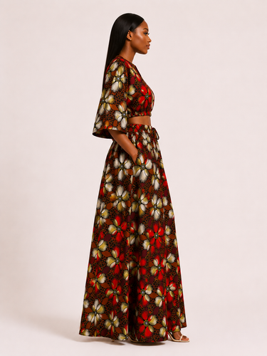 Woman wearing a butterfly-patterned outfit on a plain background