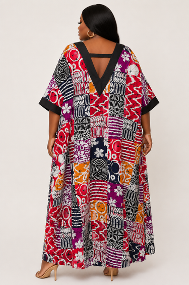 Full length view of a plus size Ankara maxi dress with A line silhouette and patchwork African print fabric perfect for wedding guest brunch and cultural festival occasions