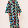 Woman wearing a colorful floral dress on a white background