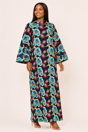 Woman wearing a colorful floral dress on a white background