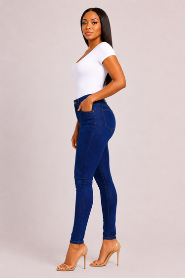 Full length view of bright cobalt blue high waist stretch denim skinny jeans with a clean saturated even wash slim fitted silhouette and classic five pocket construction with no fading or distressing