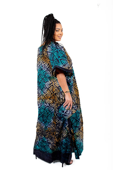 Close-up of patterned round-neck Adire kaftan with teal panel