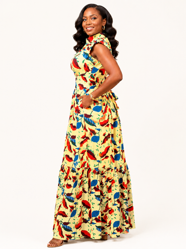 Woman wearing a colorful floral dress on a white background