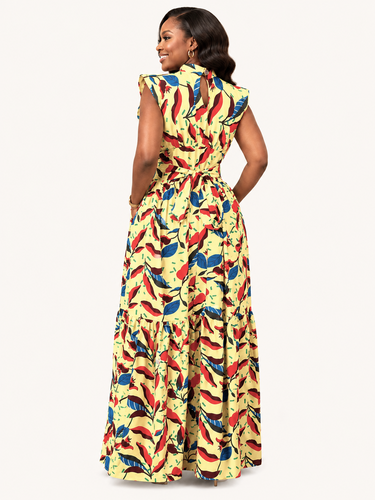 Woman wearing a colorful patterned dress on a white background