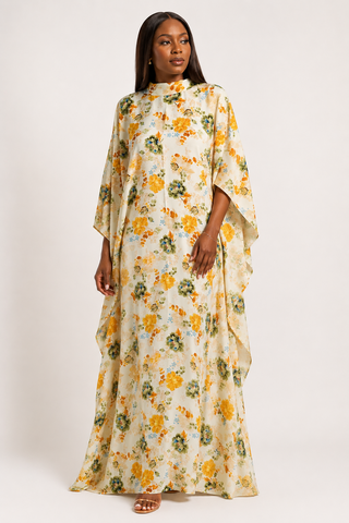 Woman wearing a floral dress with a plain background