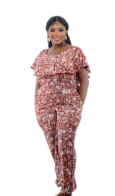 Woman wearing red Adire tie-dye jumpsuit with ruffle neckline