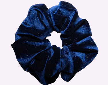 Blue glittery scrunchie on a white background