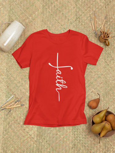 Modern faith tee displayed on a natural woven mat with accessories