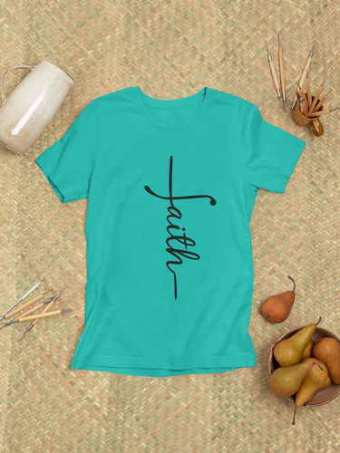 Minimalist "Faith" cross t-shirt laid flat on a woven background