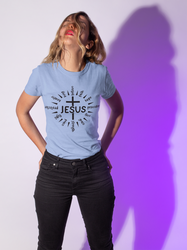 Woman wearing white Jesus-themed T-shirt with scripture words in a cross design